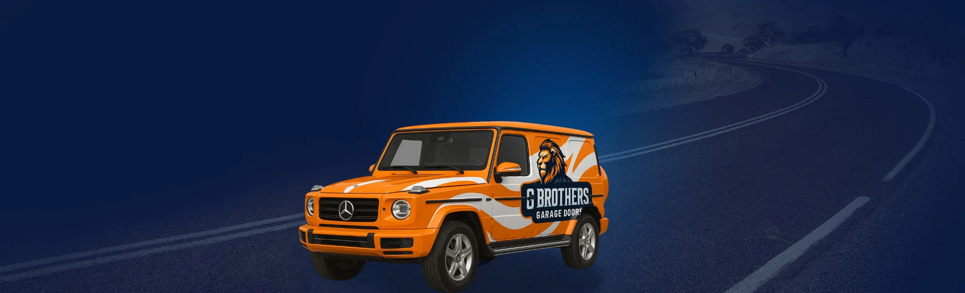 The orange G Brothers Garage Doors service vehicle on the road at dusk, ready for 24/7 emergency calls