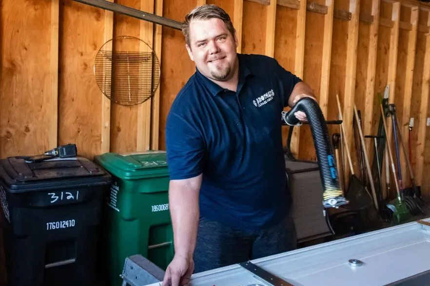 A G Brothers garage door technician on a service call in Lakewood, Colorado