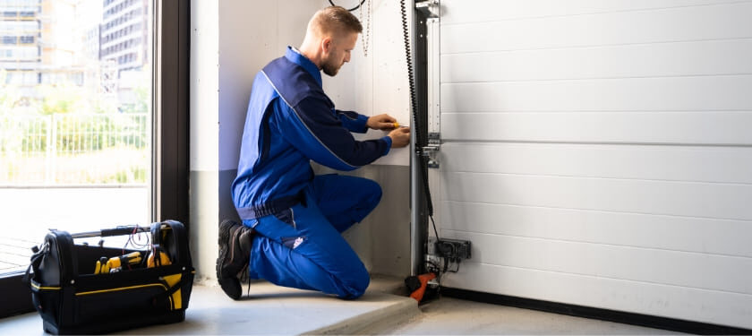 A G Brothers technician inspecting a residential garage door